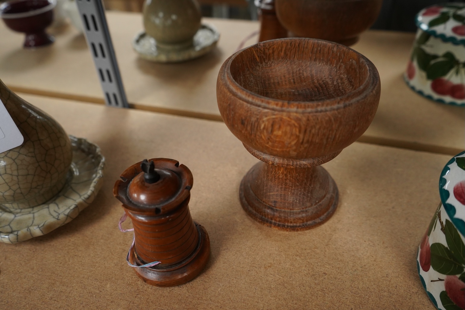 A 19th century treen tower tape measure and an oak goblet with provence label, 13cm